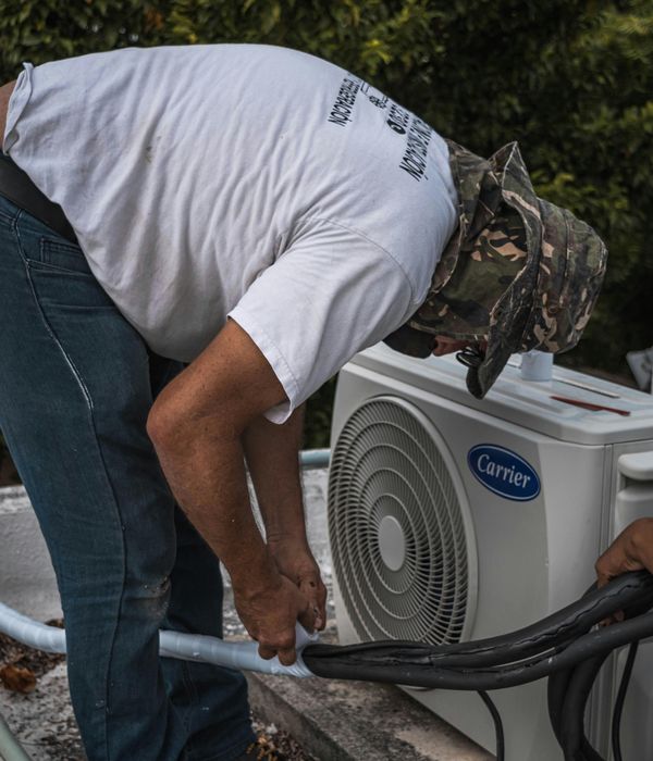 HVAC technician installing a unit